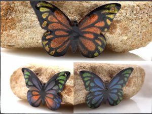 torch fired enameled charm